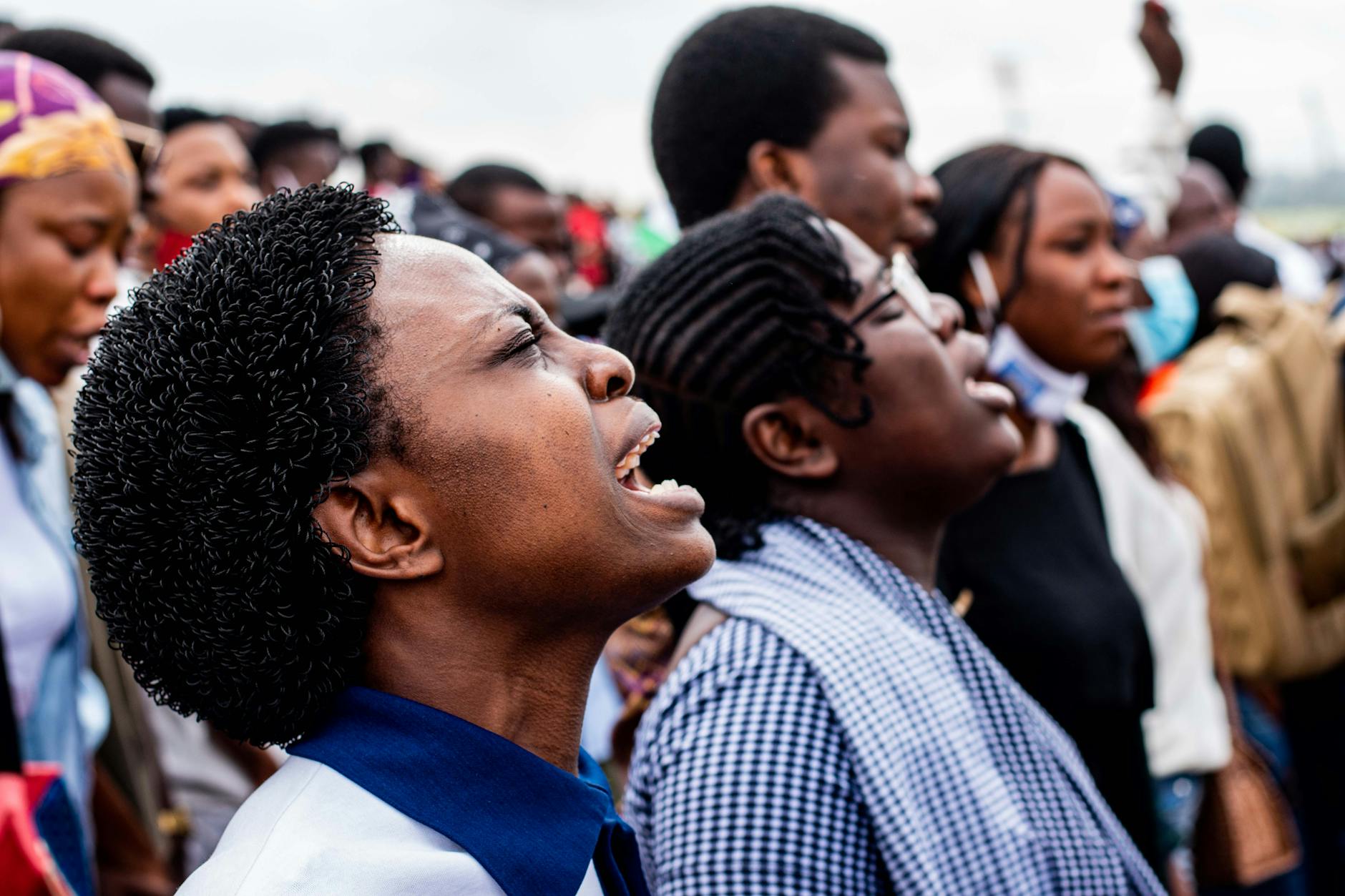 close up of a crowd singing